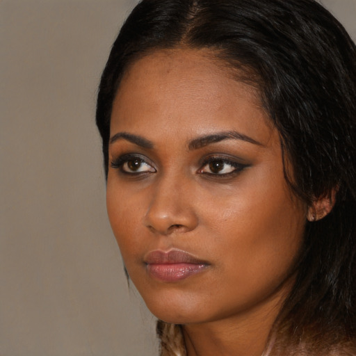Neutral black young-adult female with long  brown hair and brown eyes