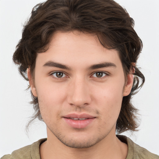 Joyful white young-adult male with medium  brown hair and brown eyes