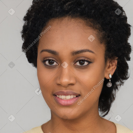 Joyful black young-adult female with long  black hair and brown eyes