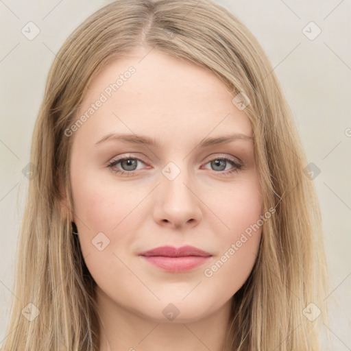 Joyful white young-adult female with long  brown hair and green eyes