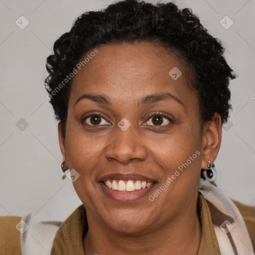 Joyful black adult female with short  brown hair and brown eyes