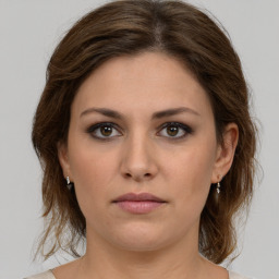 Neutral white young-adult female with medium  brown hair and brown eyes