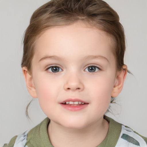 Joyful white child female with medium  brown hair and grey eyes