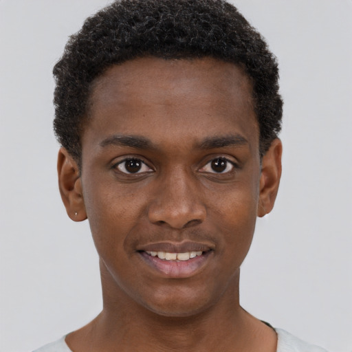 Joyful black young-adult male with short  brown hair and brown eyes