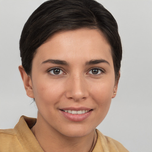 Joyful white young-adult female with short  brown hair and brown eyes