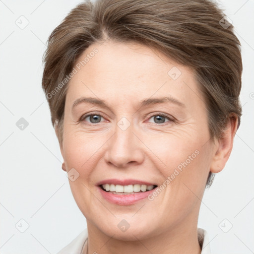 Joyful white adult female with short  brown hair and grey eyes