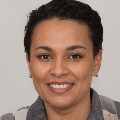 Joyful white adult female with short  brown hair and brown eyes