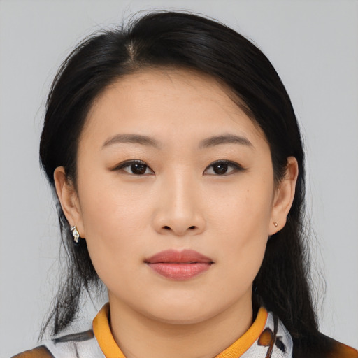 Joyful asian young-adult female with medium  black hair and brown eyes