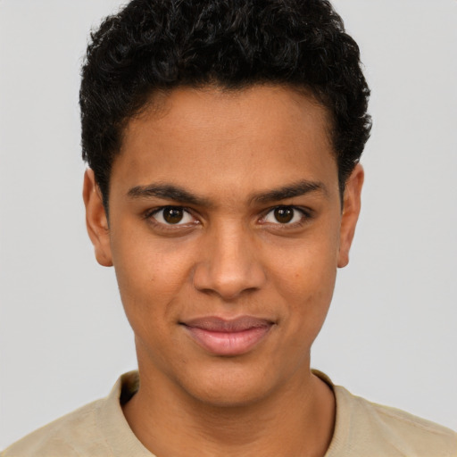 Joyful latino young-adult male with short  brown hair and brown eyes