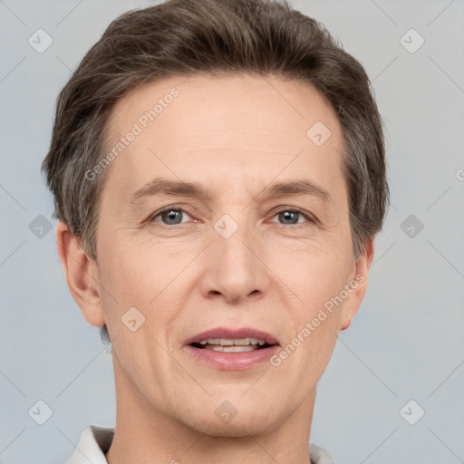 Joyful white adult male with short  brown hair and grey eyes