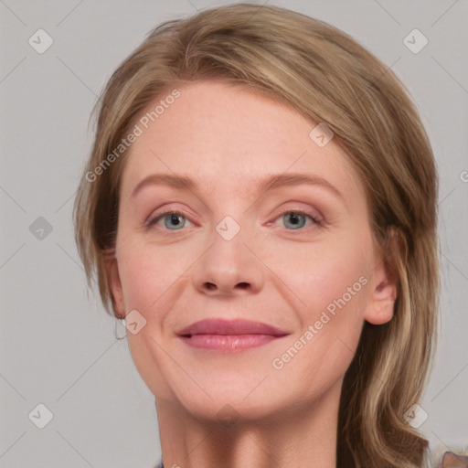 Joyful white young-adult female with medium  brown hair and blue eyes