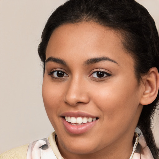 Joyful white young-adult female with medium  brown hair and brown eyes