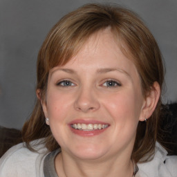 Joyful white young-adult female with medium  brown hair and blue eyes