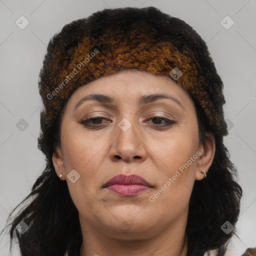 Joyful white adult female with long  brown hair and brown eyes