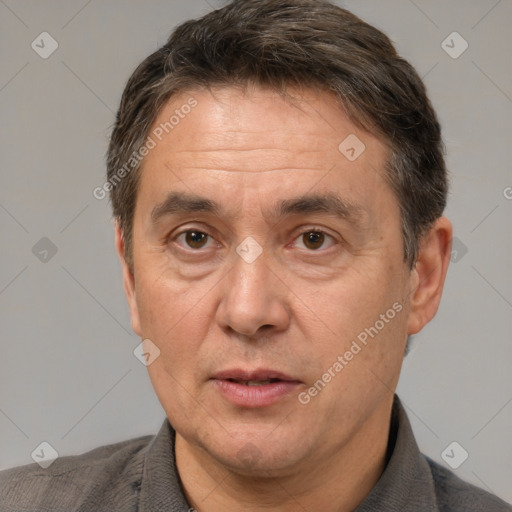 Joyful white middle-aged male with short  brown hair and brown eyes