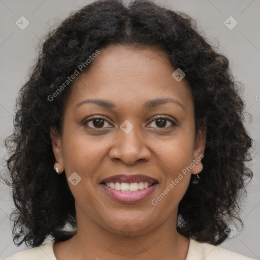 Joyful black young-adult female with medium  brown hair and brown eyes