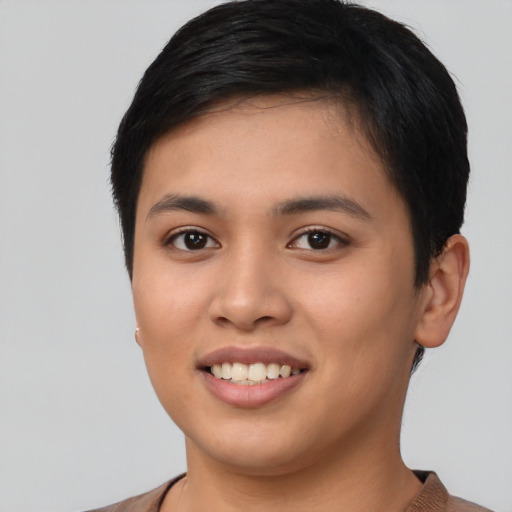 Joyful asian young-adult female with short  black hair and brown eyes