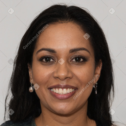 Joyful black young-adult female with long  brown hair and brown eyes