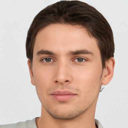 Neutral white young-adult male with short  brown hair and brown eyes