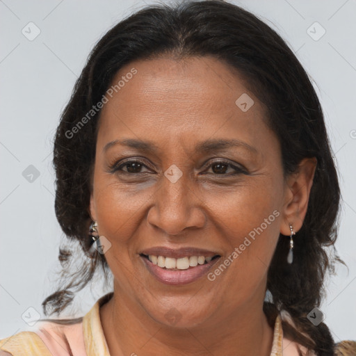 Joyful black adult female with medium  brown hair and brown eyes