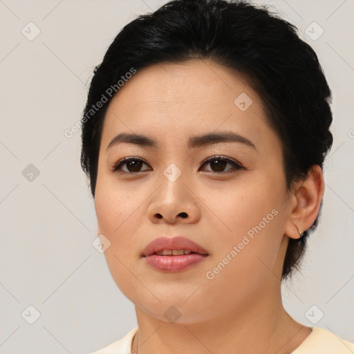 Joyful asian young-adult female with short  black hair and brown eyes