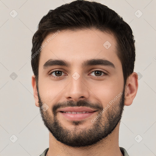 Joyful white young-adult male with short  black hair and brown eyes