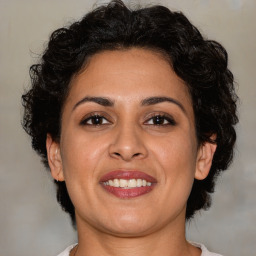 Joyful white adult female with medium  brown hair and brown eyes