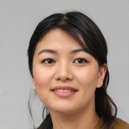 Joyful white young-adult female with medium  black hair and brown eyes
