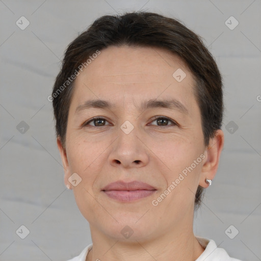 Joyful white adult female with short  brown hair and brown eyes