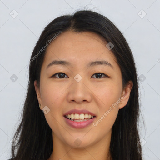 Joyful asian young-adult female with long  brown hair and brown eyes