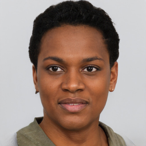 Joyful black young-adult female with short  black hair and brown eyes