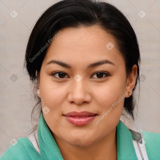 Joyful asian young-adult female with medium  brown hair and brown eyes