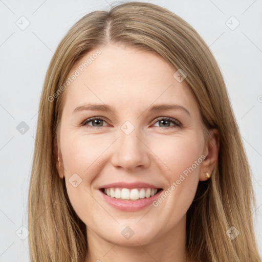 Joyful white young-adult female with long  brown hair and brown eyes