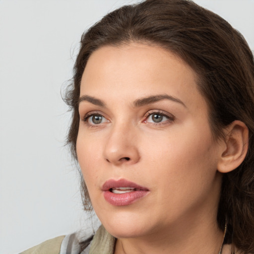 Neutral white young-adult female with medium  brown hair and brown eyes