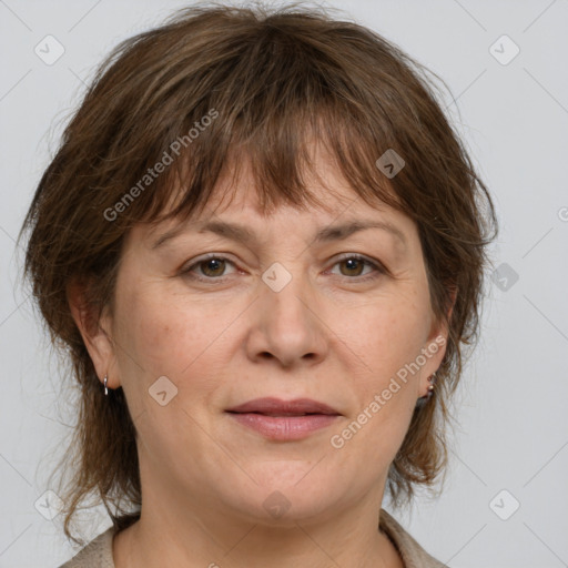 Joyful white adult female with medium  brown hair and grey eyes