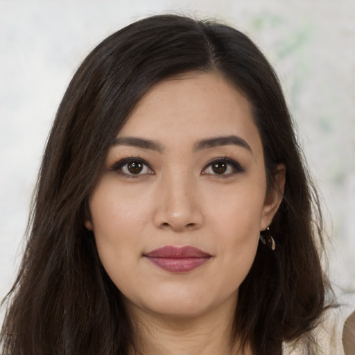 Joyful asian young-adult female with long  brown hair and brown eyes