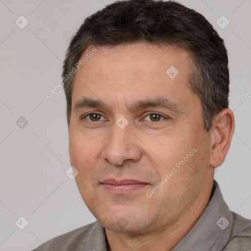 Joyful white adult male with short  brown hair and brown eyes