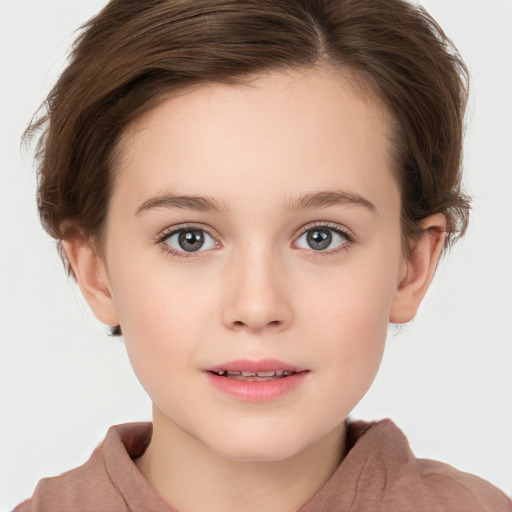 Joyful white child female with short  brown hair and brown eyes