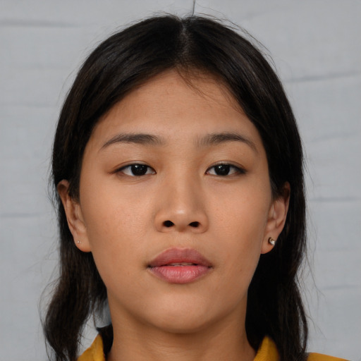 Neutral asian young-adult female with medium  brown hair and brown eyes
