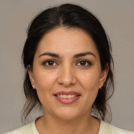 Joyful white young-adult female with medium  brown hair and brown eyes