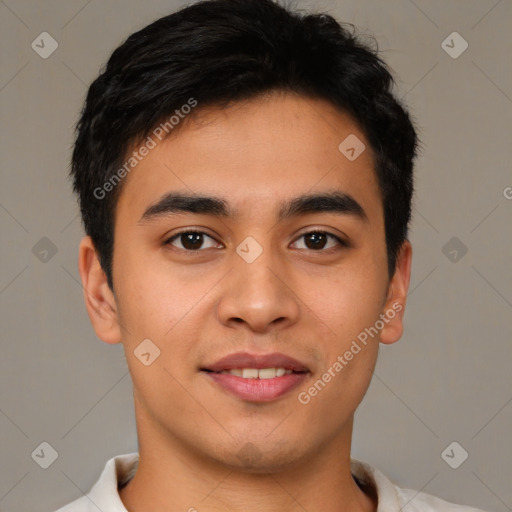 Joyful asian young-adult male with short  brown hair and brown eyes