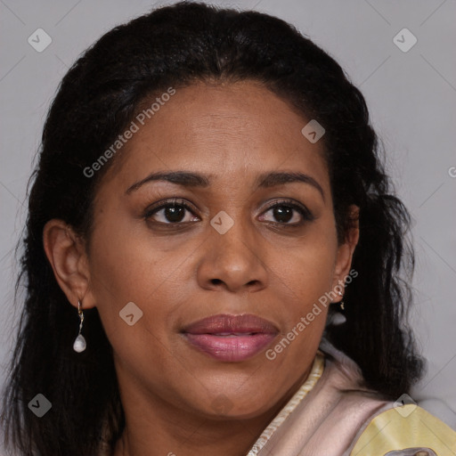 Joyful black adult female with long  brown hair and brown eyes