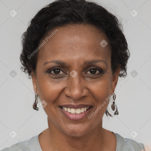 Joyful black adult female with short  brown hair and brown eyes