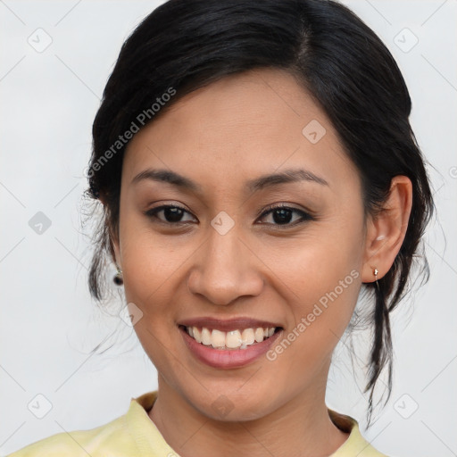 Joyful asian young-adult female with medium  brown hair and brown eyes