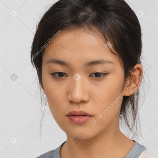 Neutral asian young-adult female with medium  brown hair and brown eyes