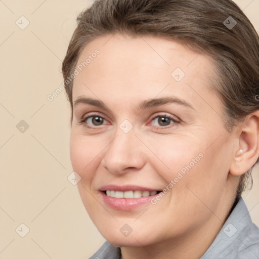 Joyful white adult female with short  brown hair and brown eyes