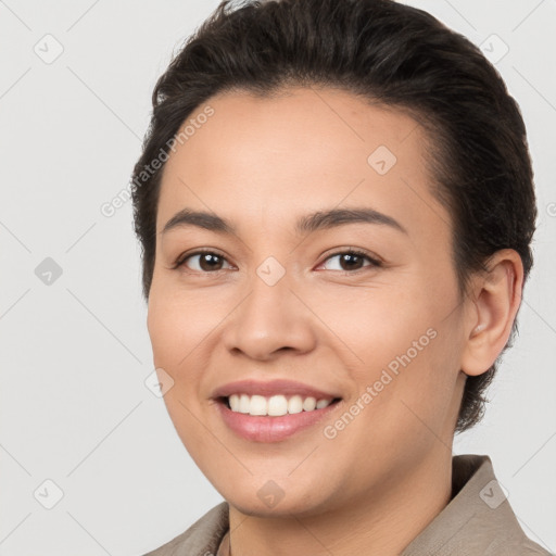 Joyful white young-adult female with short  brown hair and brown eyes