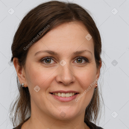 Joyful white adult female with medium  brown hair and grey eyes