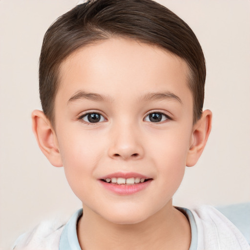 Joyful white child male with short  brown hair and brown eyes