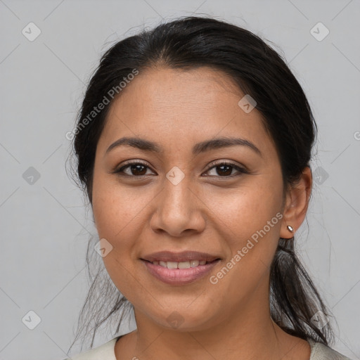 Joyful latino young-adult female with medium  brown hair and brown eyes